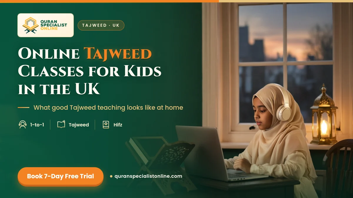 A girl in a cream hijab and headphones recites carefully during an online Tajweed lesson, with a closed Quran on a wooden stand beside her laptop.